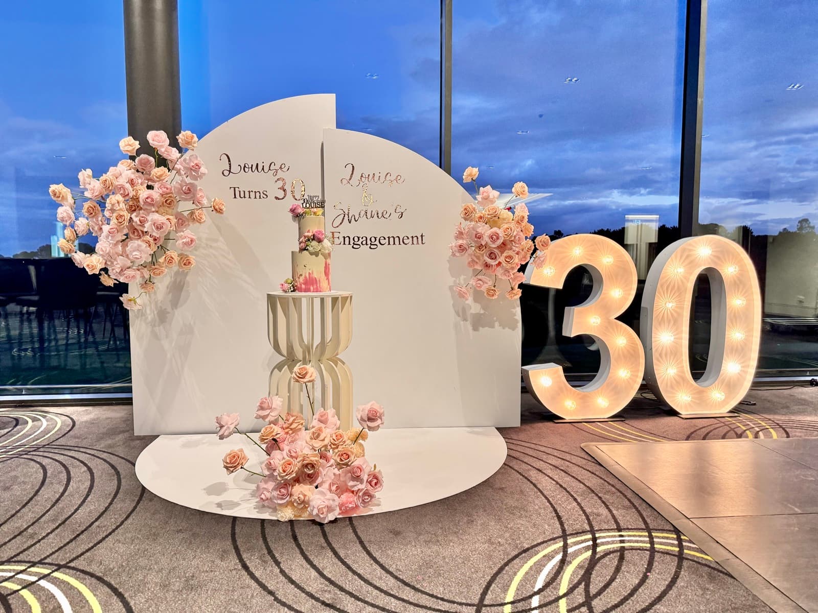 Baby shower event styling with pastel decorations and balloon arrangements