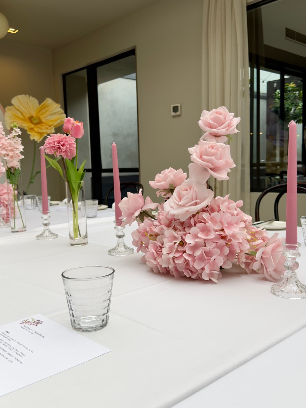 Baby shower event styling with pastel decorations and balloon arrangements