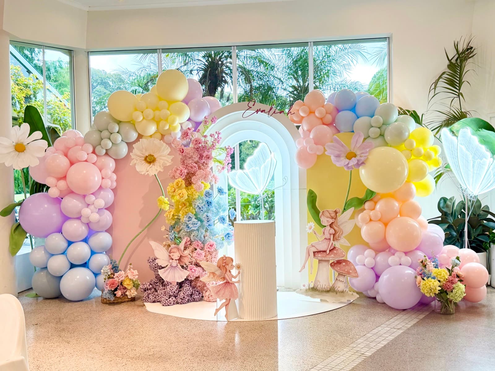 Baby shower event styling with pastel decorations and balloon arrangements