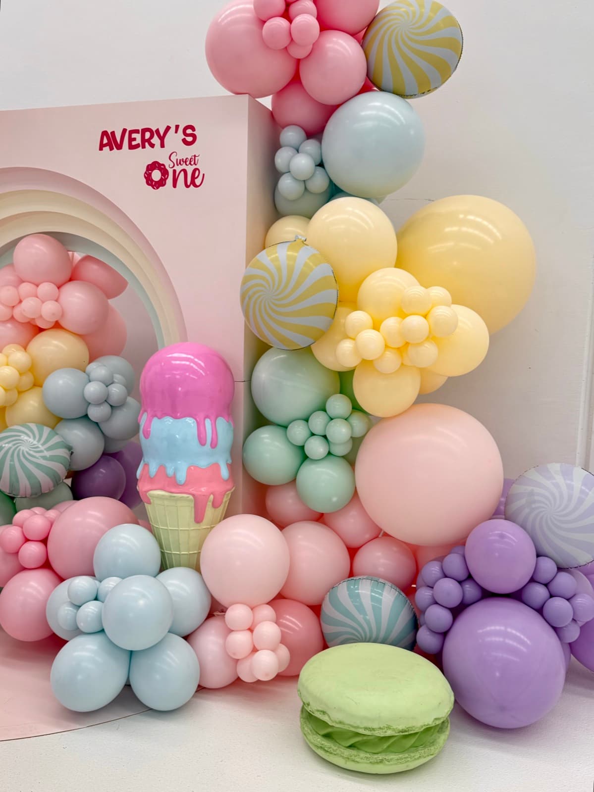 Birthday party styling with balloon installations and themed decorations