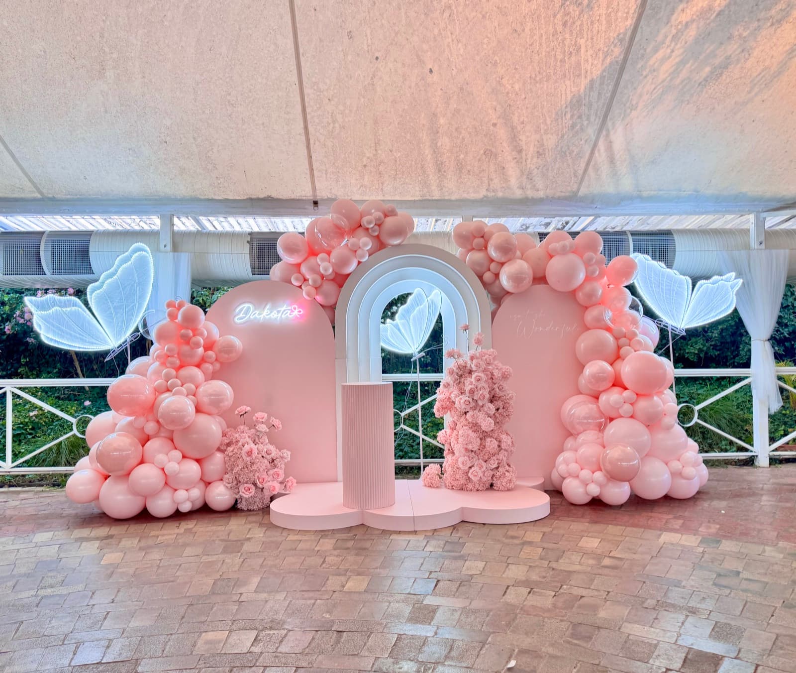 Birthday party styling with balloon installations and themed decorations