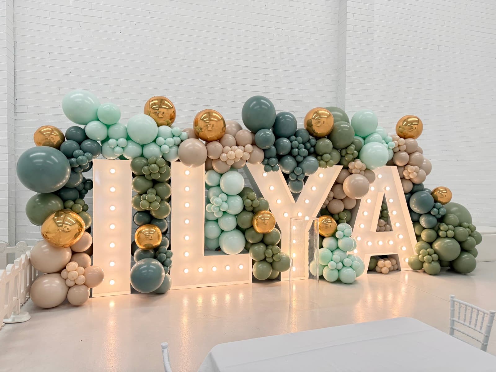 Birthday party styling with balloon installations and themed decorations