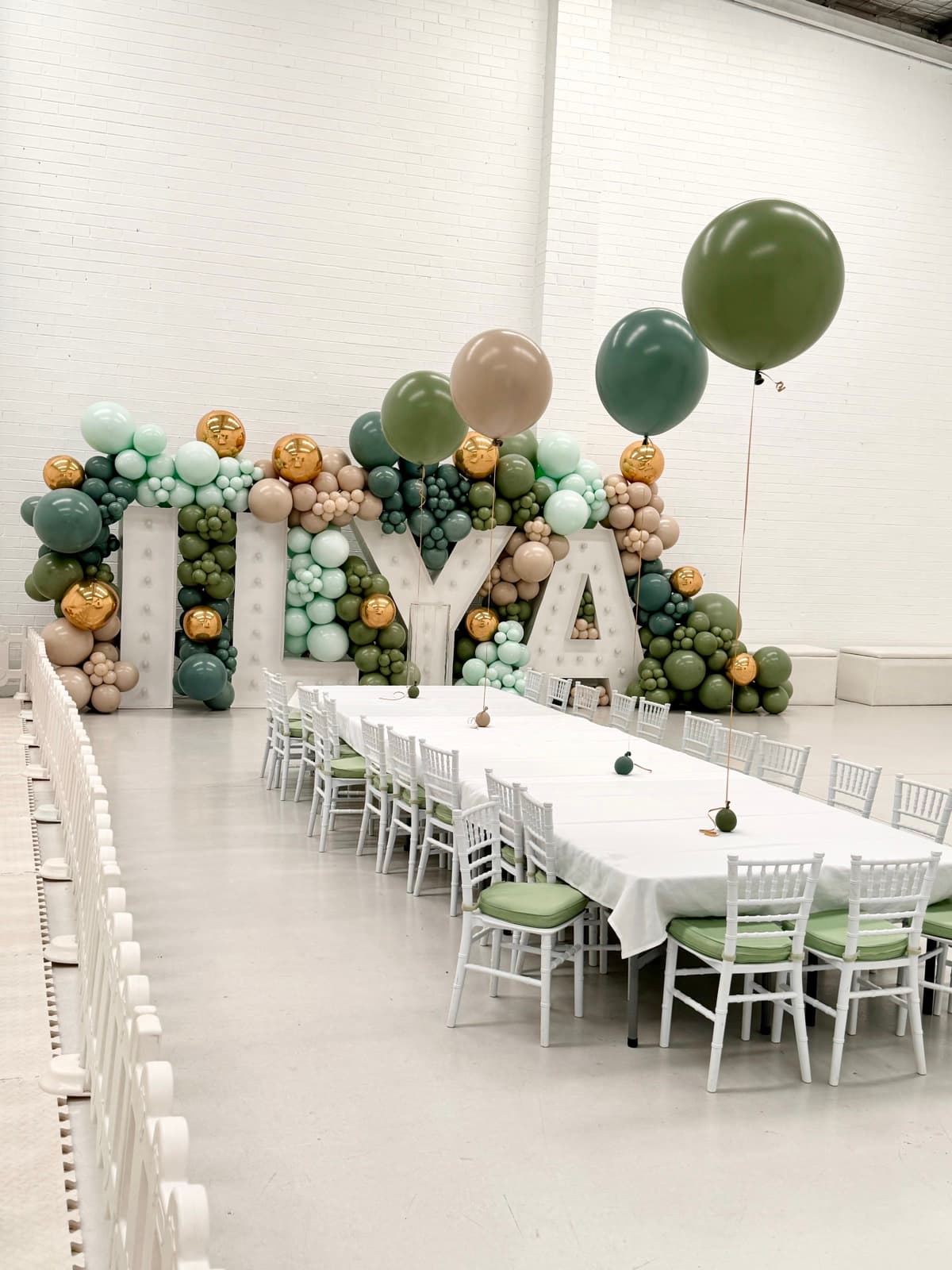 Birthday party styling with balloon installations and themed decorations