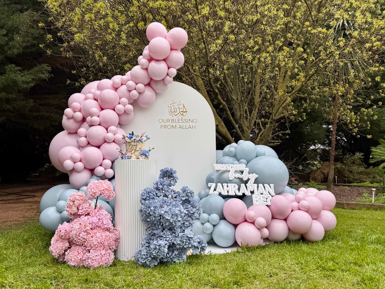 Birthday party styling with balloon installations and themed decorations