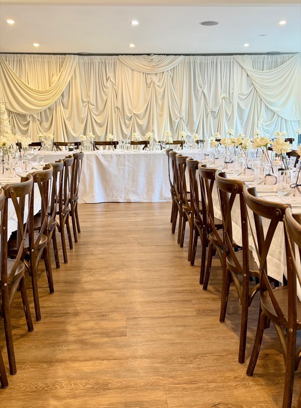Wedding reception styling with draping florals and table settings