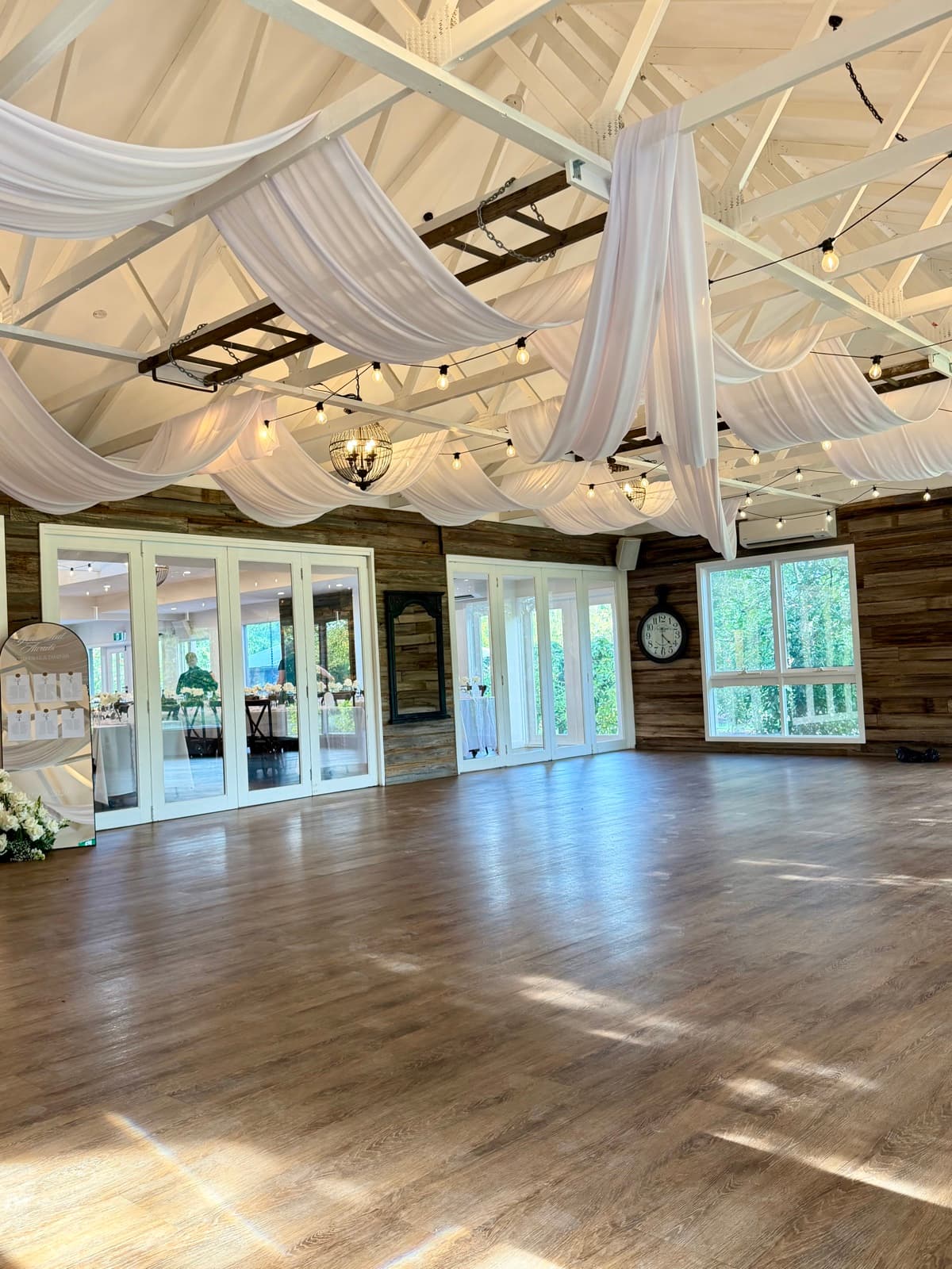 Wedding reception styling with draping florals and table settings
