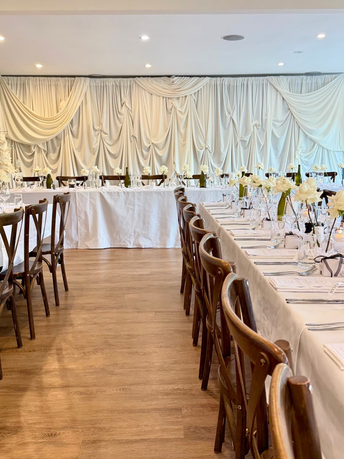 Wedding reception styling with draping florals and table settings